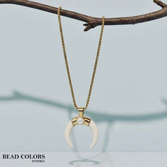COLLAR LARGO CUERNO CREMA ACERO