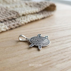 DIJE ESTAMBRE Y AGUJA PLATA .925