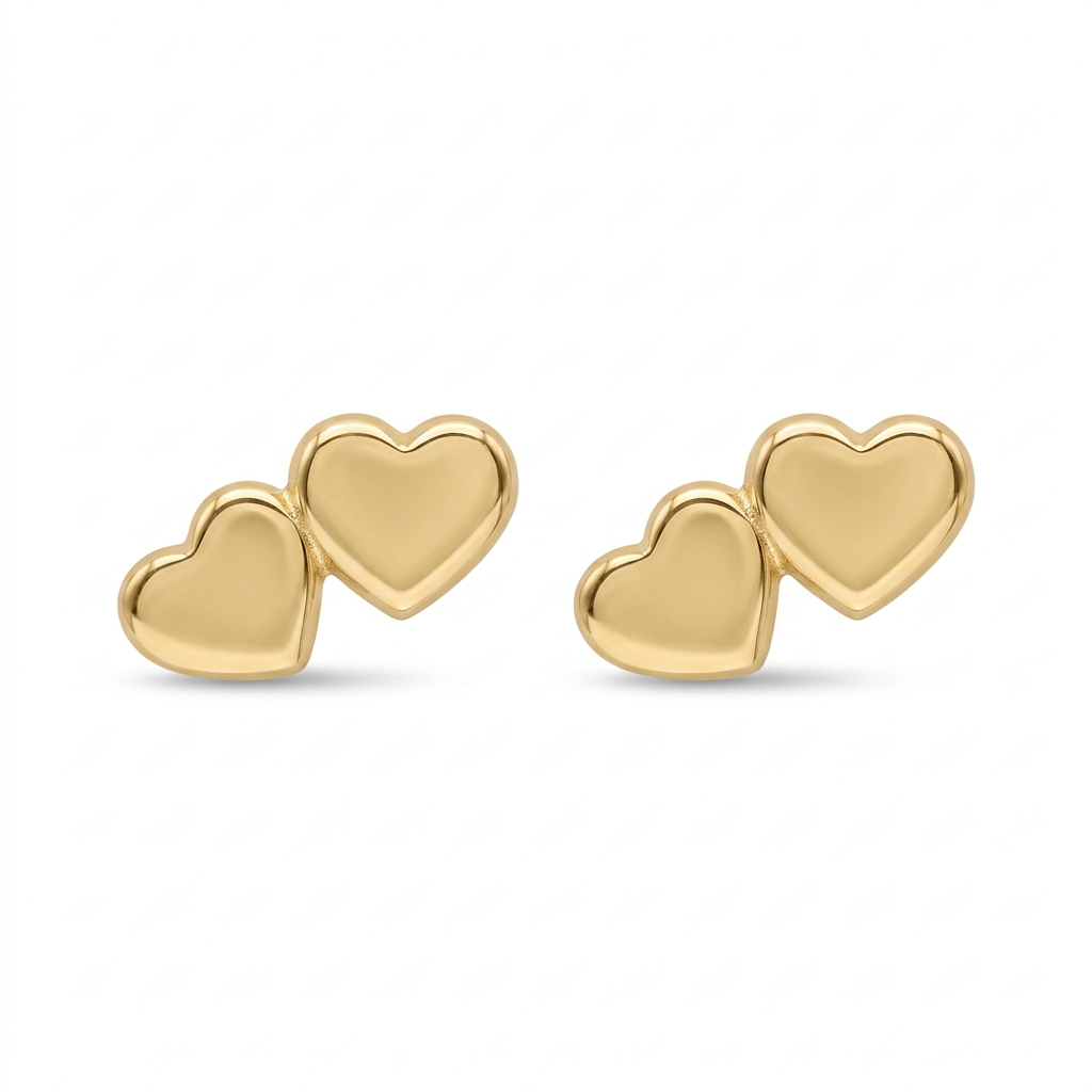 Par de broqueles de oro 10K, cada uno con dos corazones lisos de distinto tamaño sobre fondo blanco.